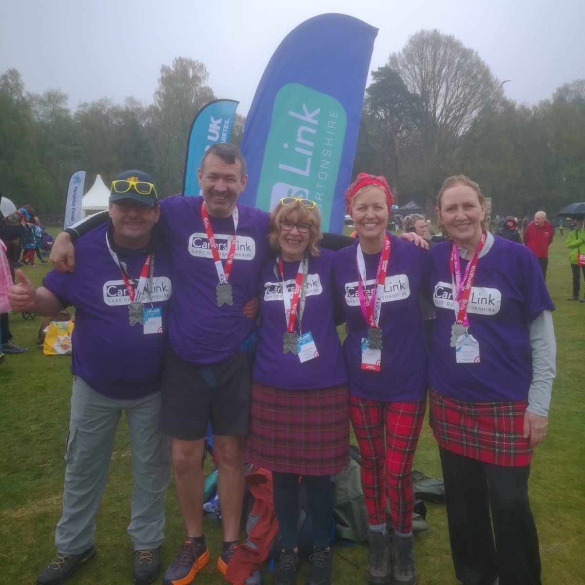 Kiltwalkers celebrate completing the walk